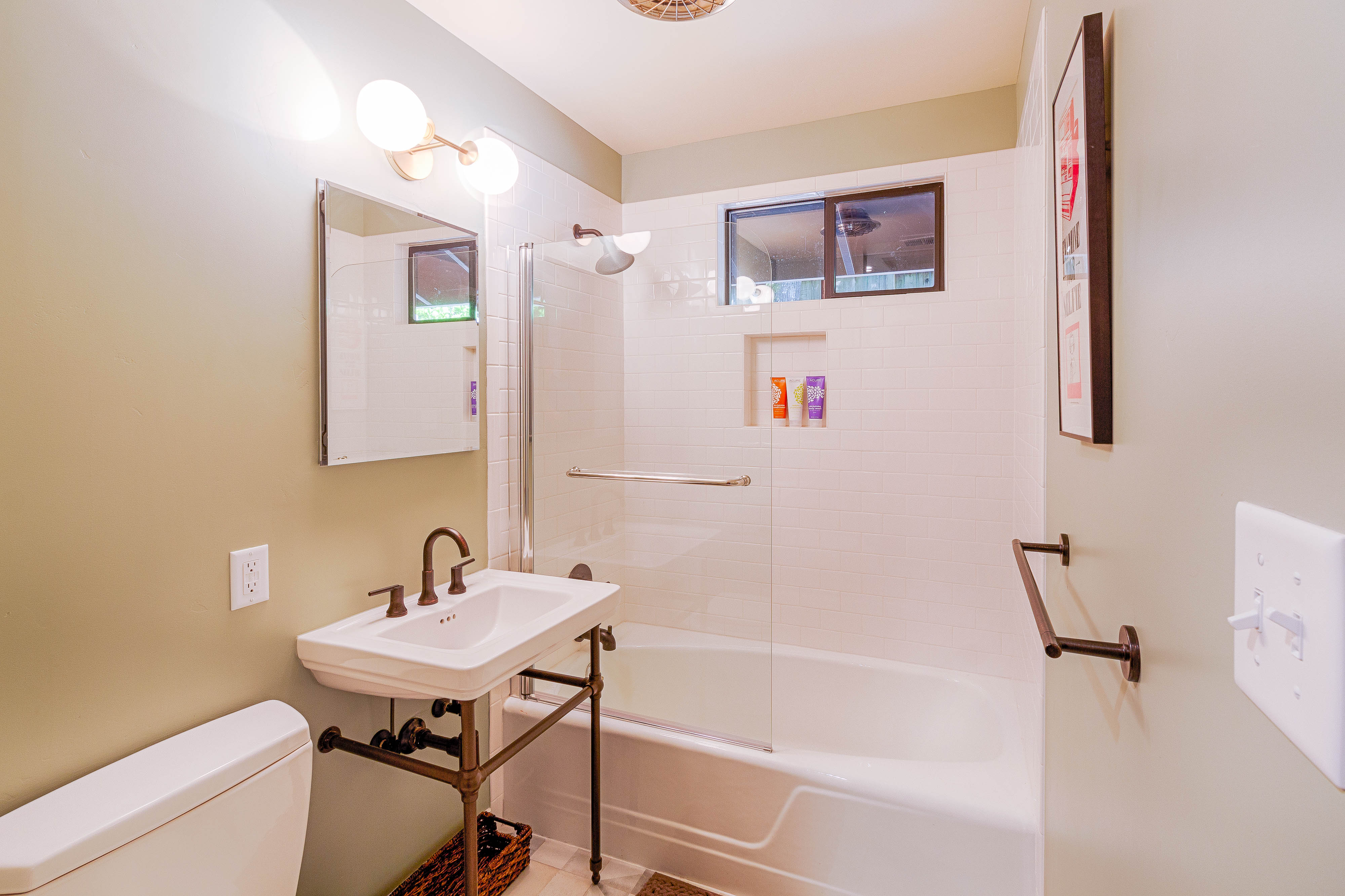 A bright bathroom with a walk-in shower